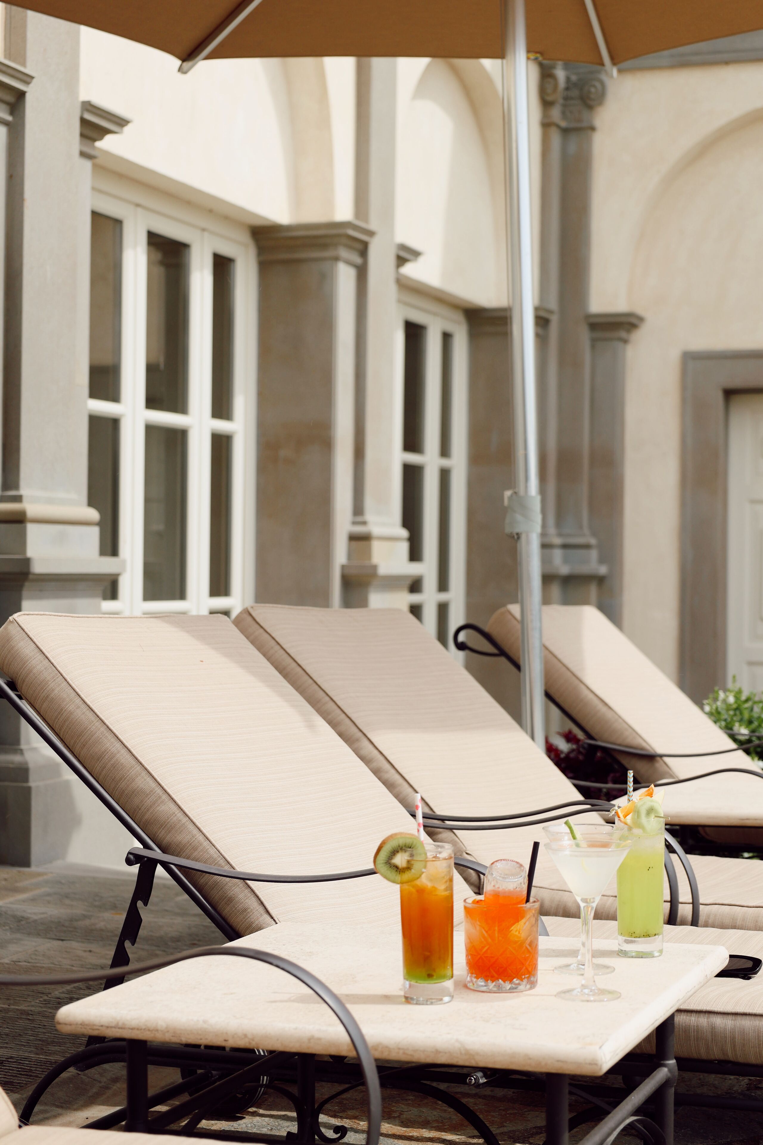 A lounge area with reclining chairs and a table with drinks.