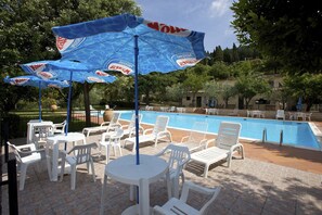 Outdoor pool, open 7:00 AM to 9:00 PM, pool umbrellas, pool loungers