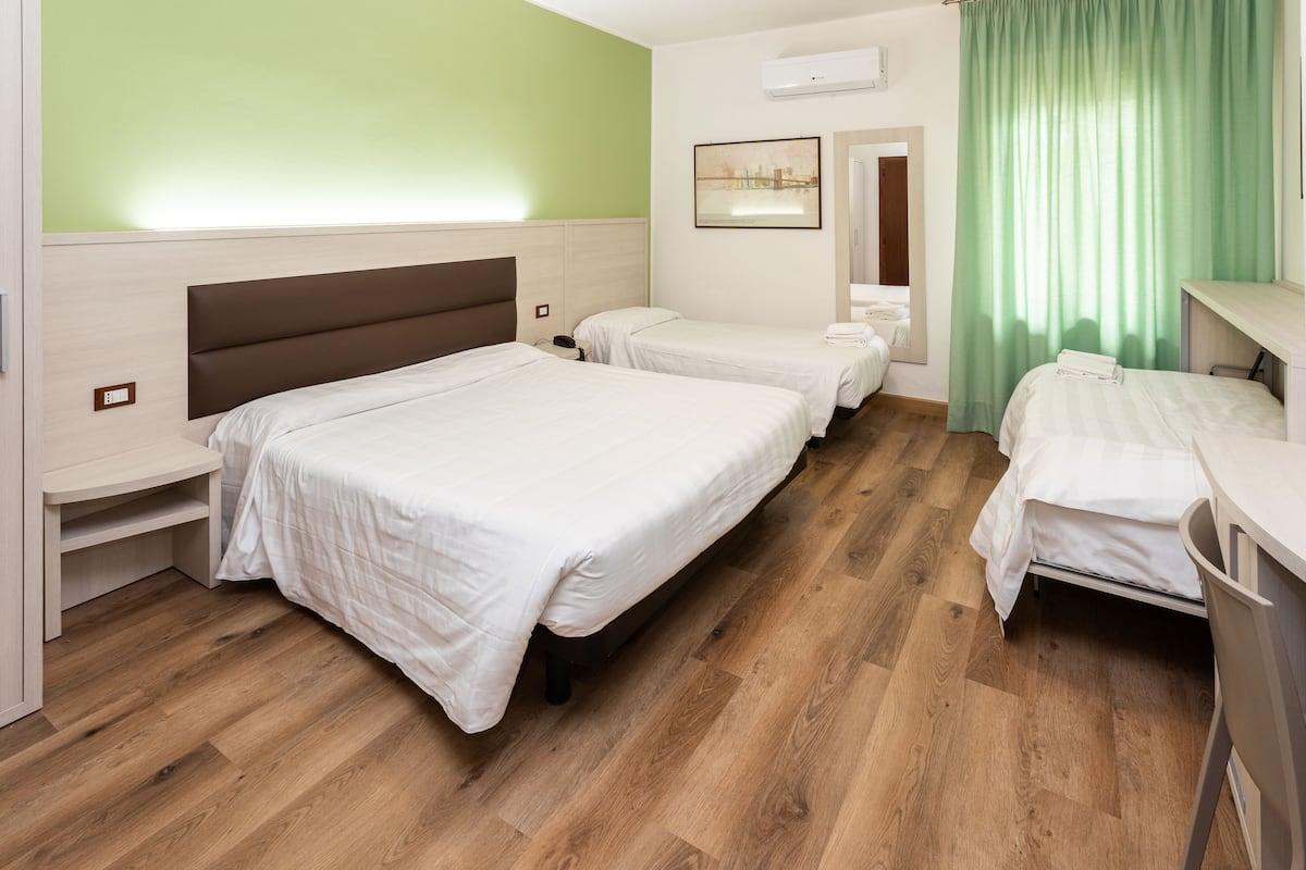 Quadruple Room | Desk, blackout drapes, iron/ironing board, cribs/infant beds