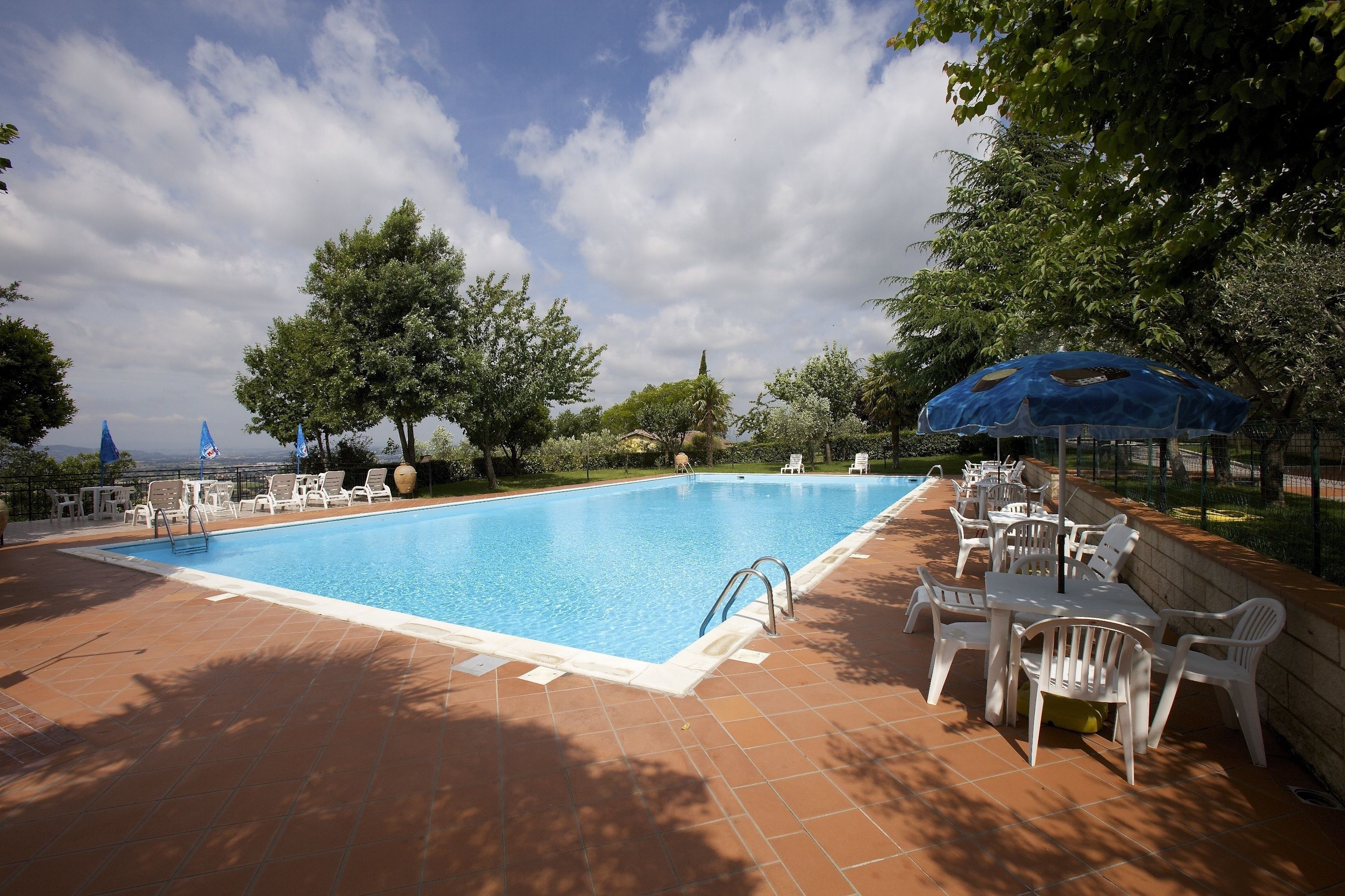 outdoor pool, open 7:00 am to 9:00 pm, pool umbrellas, pool loungers