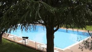 Outdoor pool, open 7:00 AM to 9:00 PM, pool umbrellas, sun loungers