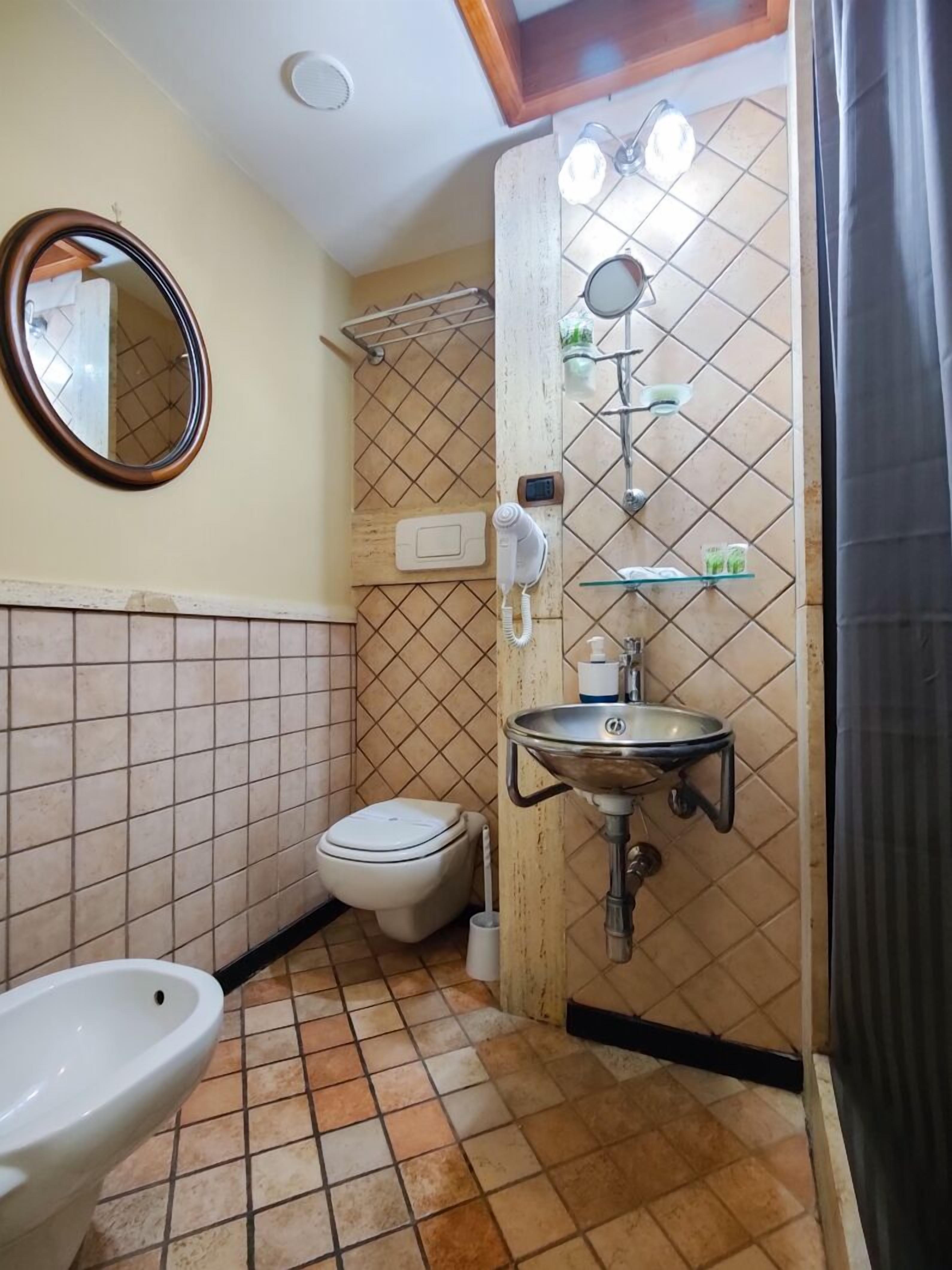 rainfall showerhead, hair dryer, bathrobes, slippers