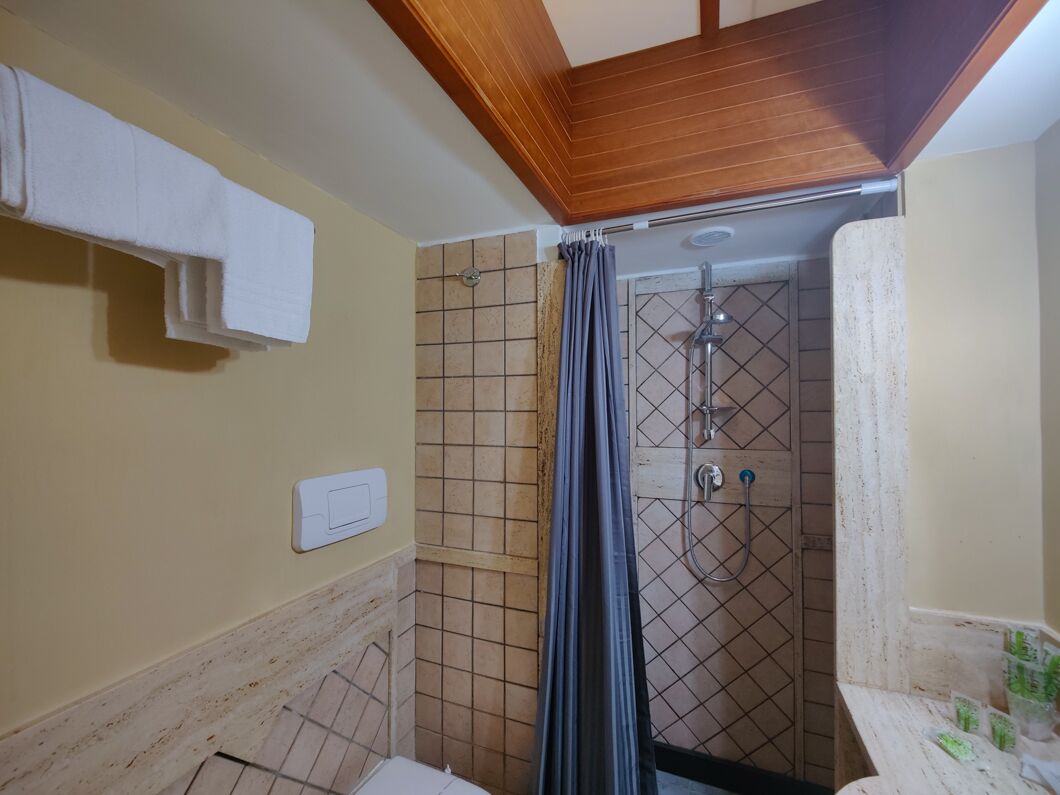 rainfall showerhead, hair dryer, bathrobes, slippers