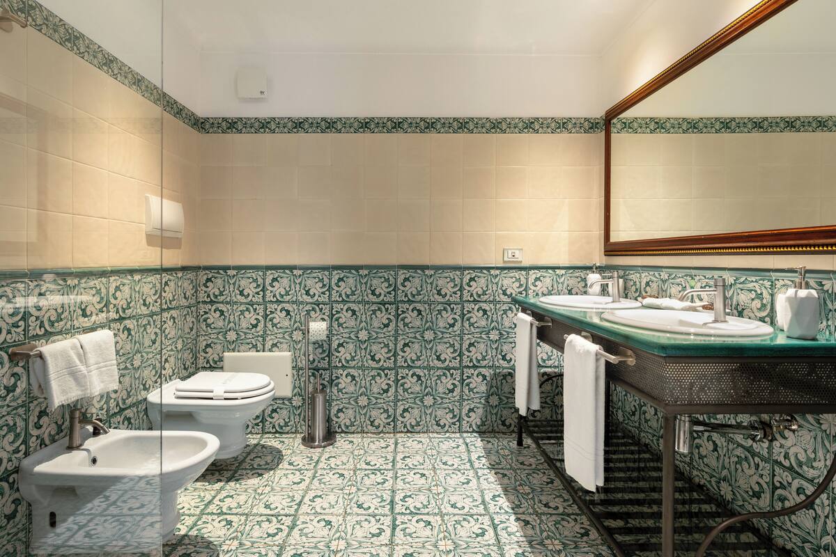 suite | bathroom | designer toiletries, hair dryer, slippers, bidet