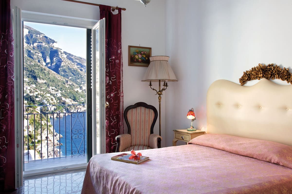 Suite, 2 chambres, vue mer | Draps en coton égyptien, literie de qualité supérieure, minibar