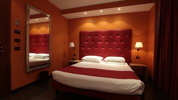 Hypo-allergenic bedding, down comforters, minibar, in-room safe