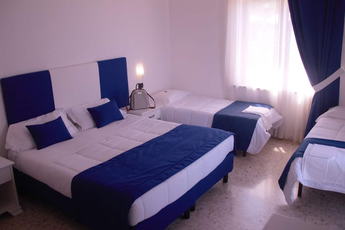 Quadruple Room, Sea View | Minibar, in-room safe, iron/ironing board, cribs/infant beds