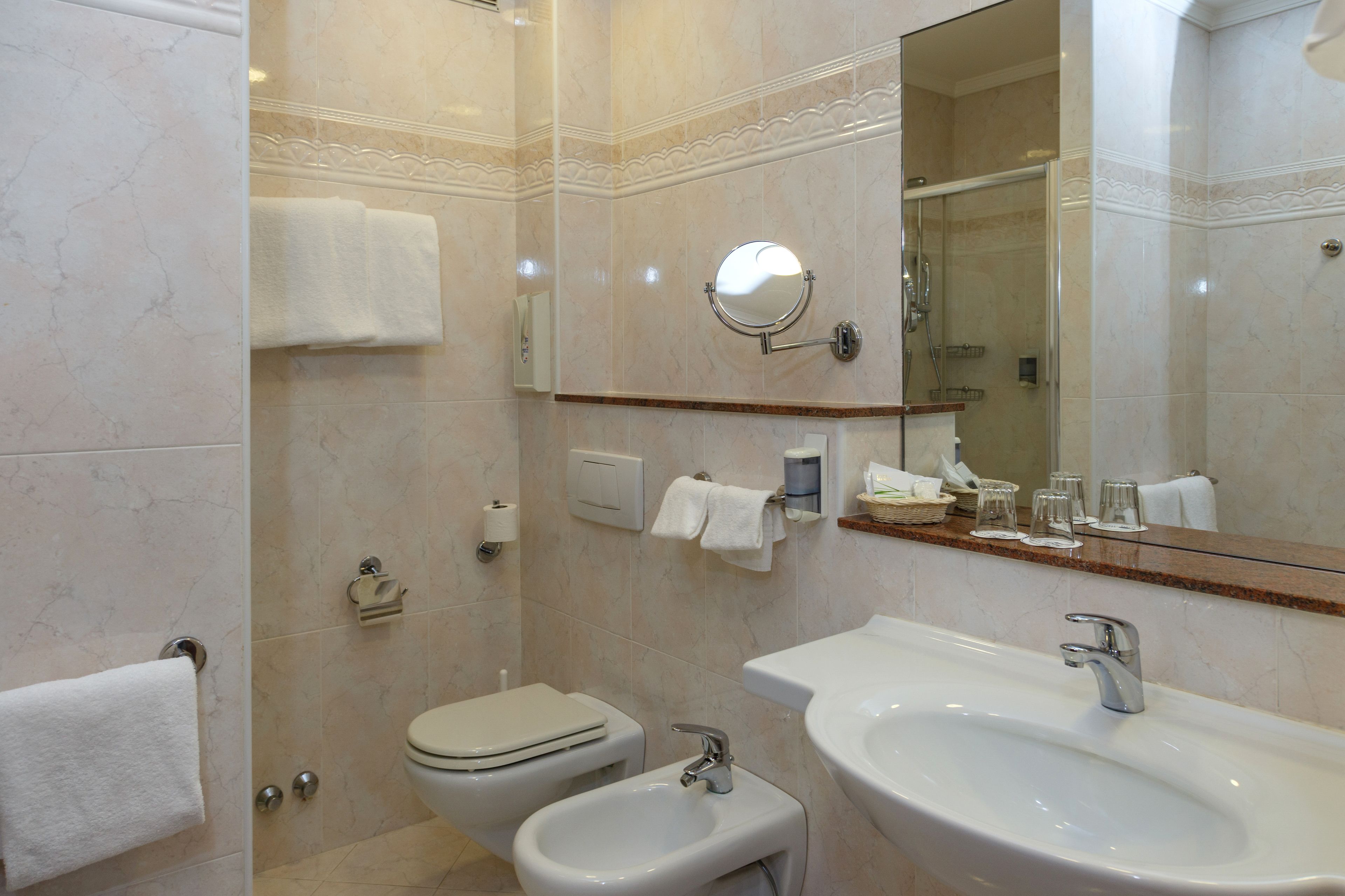 free toiletries, hair dryer, bidet, towels