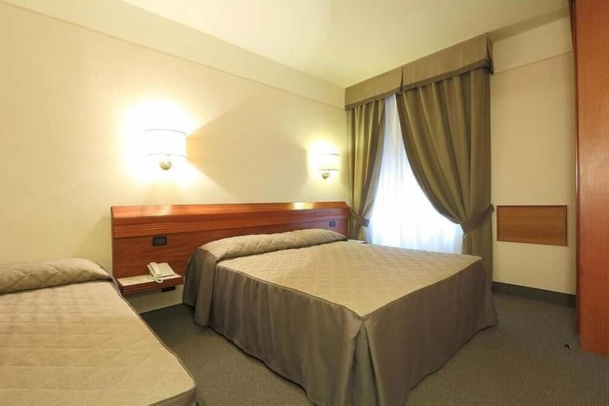 Triple Room | Hypo-allergenic bedding, minibar, in-room safe, desk