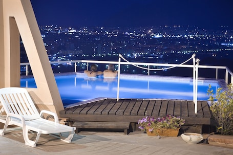 Seasonal outdoor pool, open 9:00 AM to 8:00 PM, pool umbrellas. Hotel Bel 3
