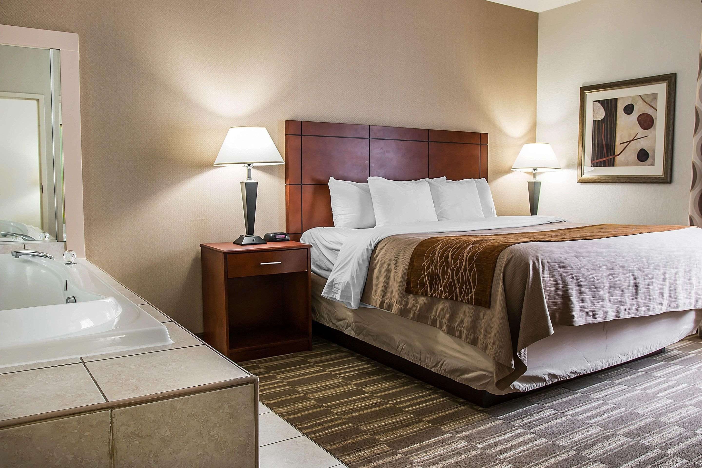 Desk, laptop workspace, blackout drapes, iron/ironing board