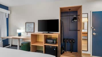 Desk, laptop workspace, blackout drapes, iron/ironing board