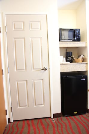 Desk, laptop workspace, blackout drapes, iron/ironing board