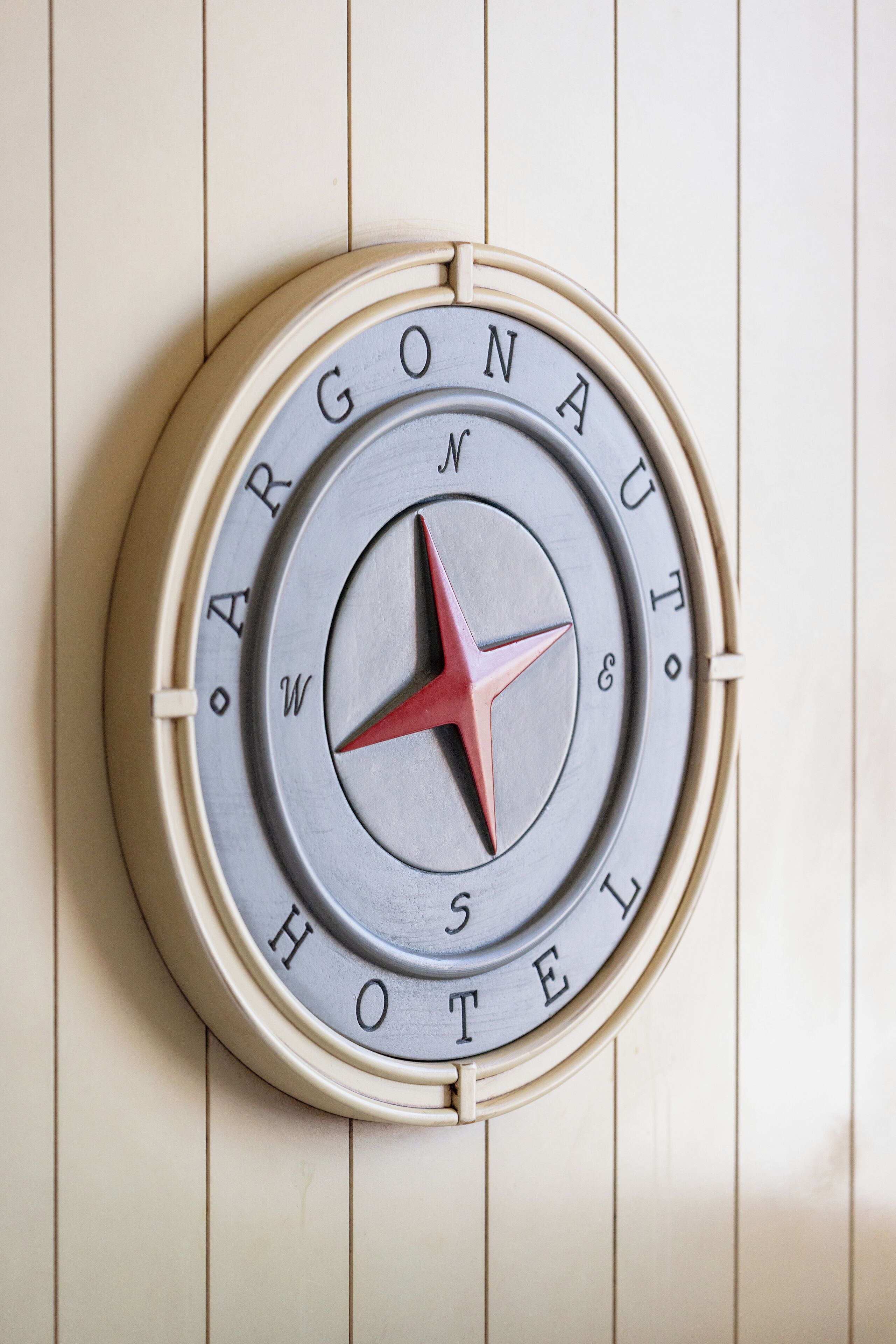 A compass with the words "ARGONAUT HOTEL" encircling it.