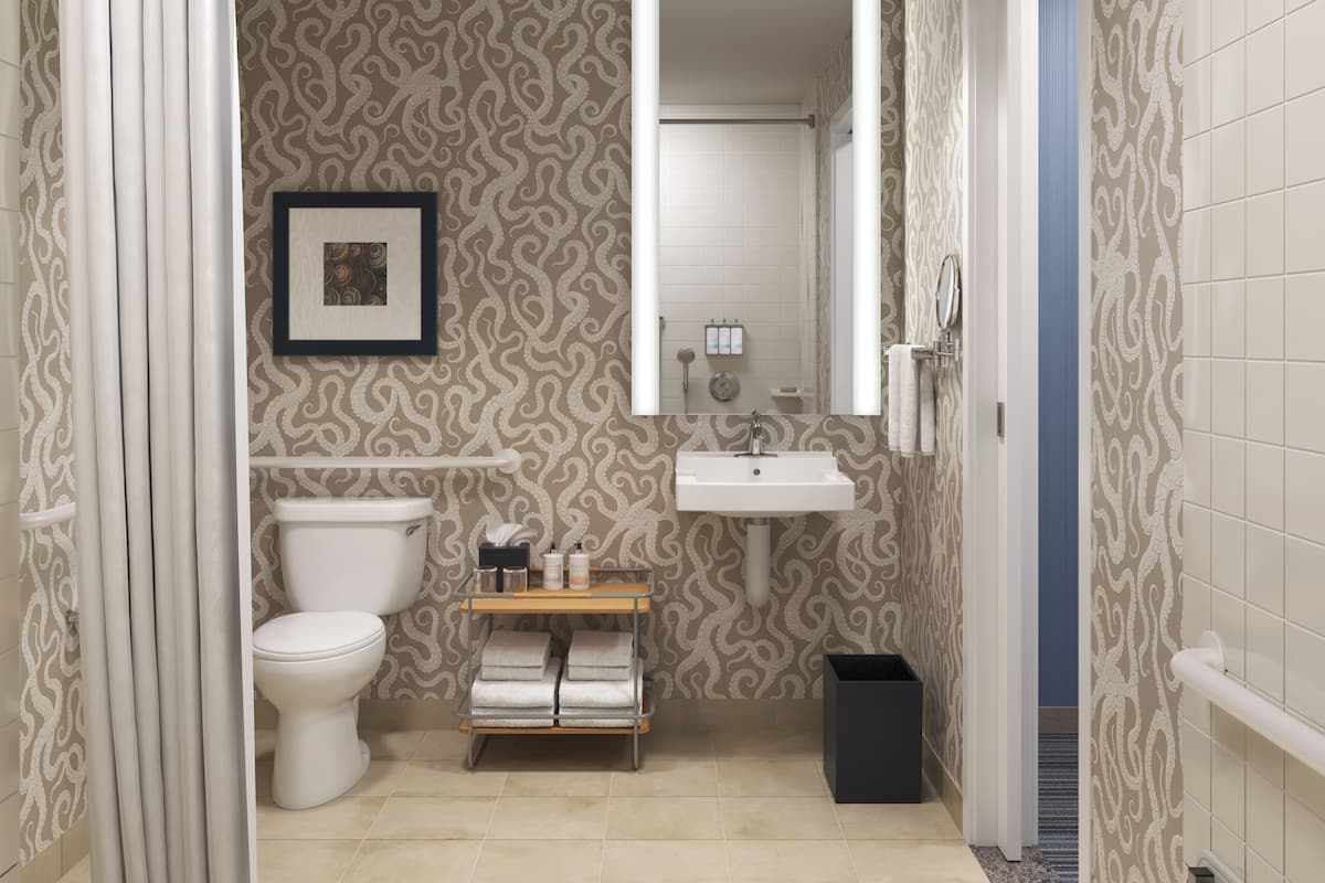 combined shower/bathtub, designer toiletries, hair dryer, bathrobes