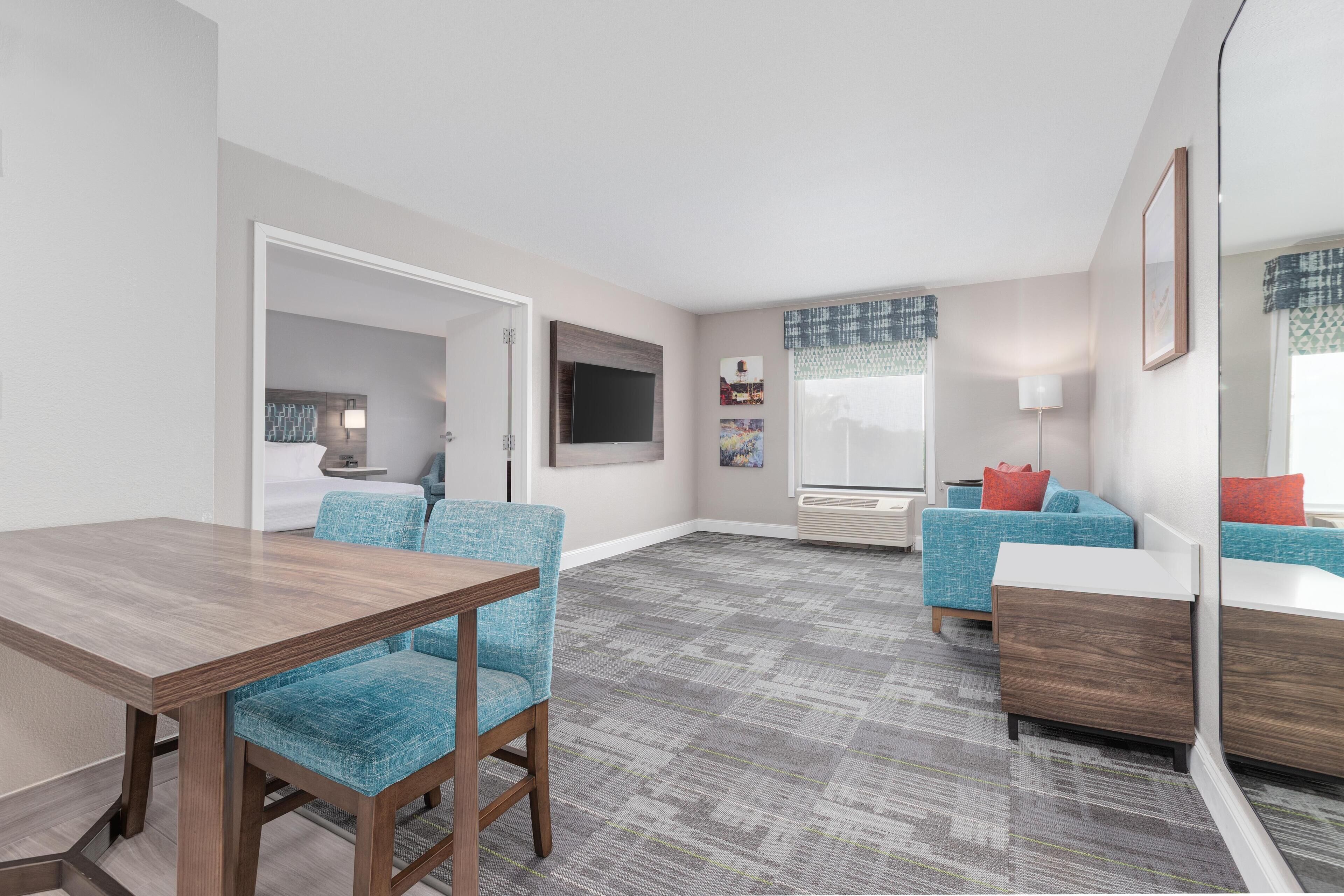 Suite, 1 King Bed, Non Smoking | Desk, laptop workspace, blackout drapes, iron/ironing board