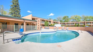 Seasonal outdoor pool, open 10:00 AM to 9:00 PM, pool umbrellas