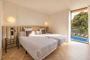 Luxe beddengoed, een minibar, een kluis op de kamer, een bureau