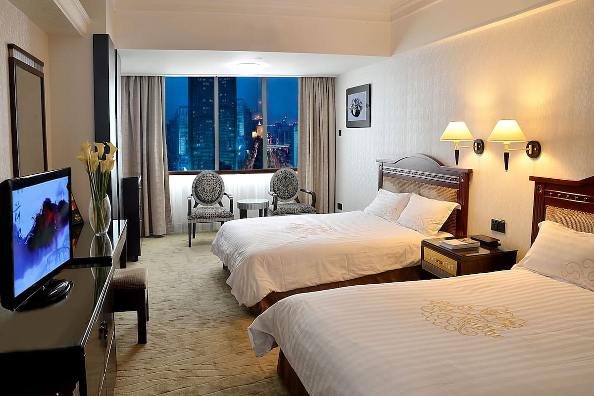 Deluxe Twin kamer | Luxe beddengoed, donzen dekbedden, een minibar, een kluis op de kamer