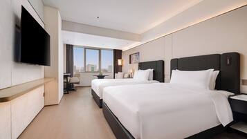 Premium bedding, down comforters, minibar, in-room safe