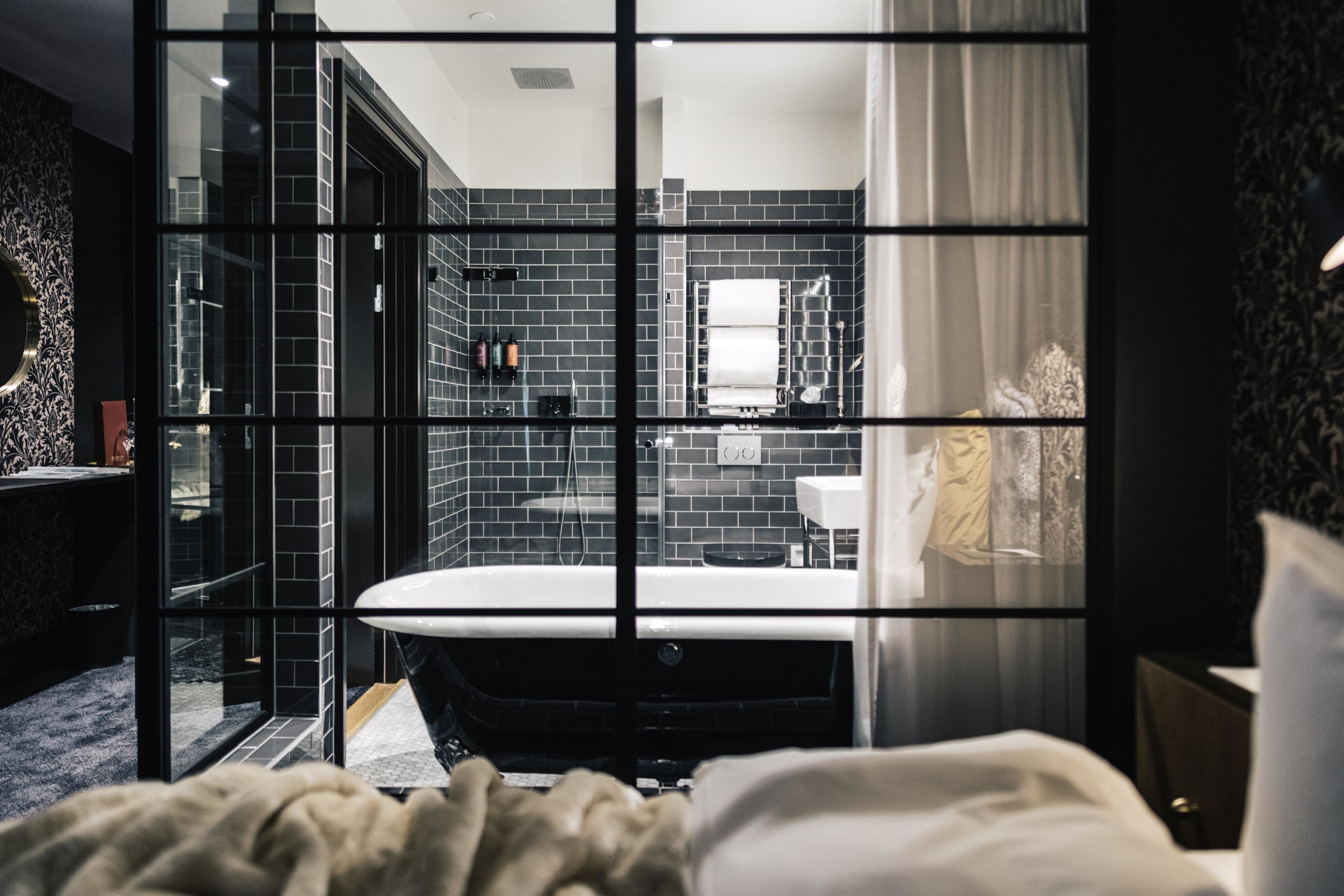 junior suite, 1 king bed, non smoking | bathroom | hair dryer, towels