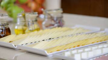 A tray of sliced fruits and a white tray with a grid pattern.