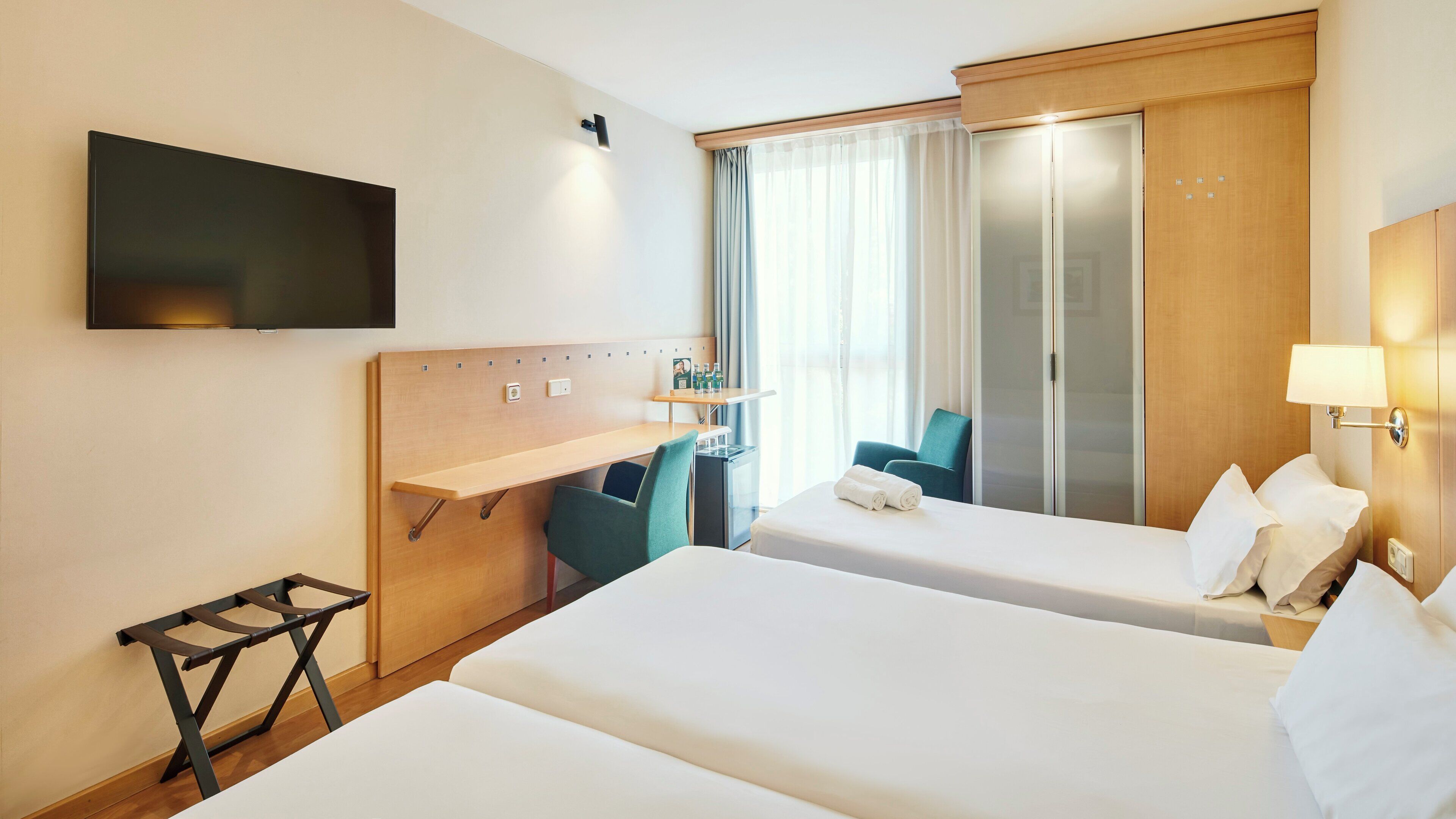 family room | minibar, in-room safe, desk, blackout curtains