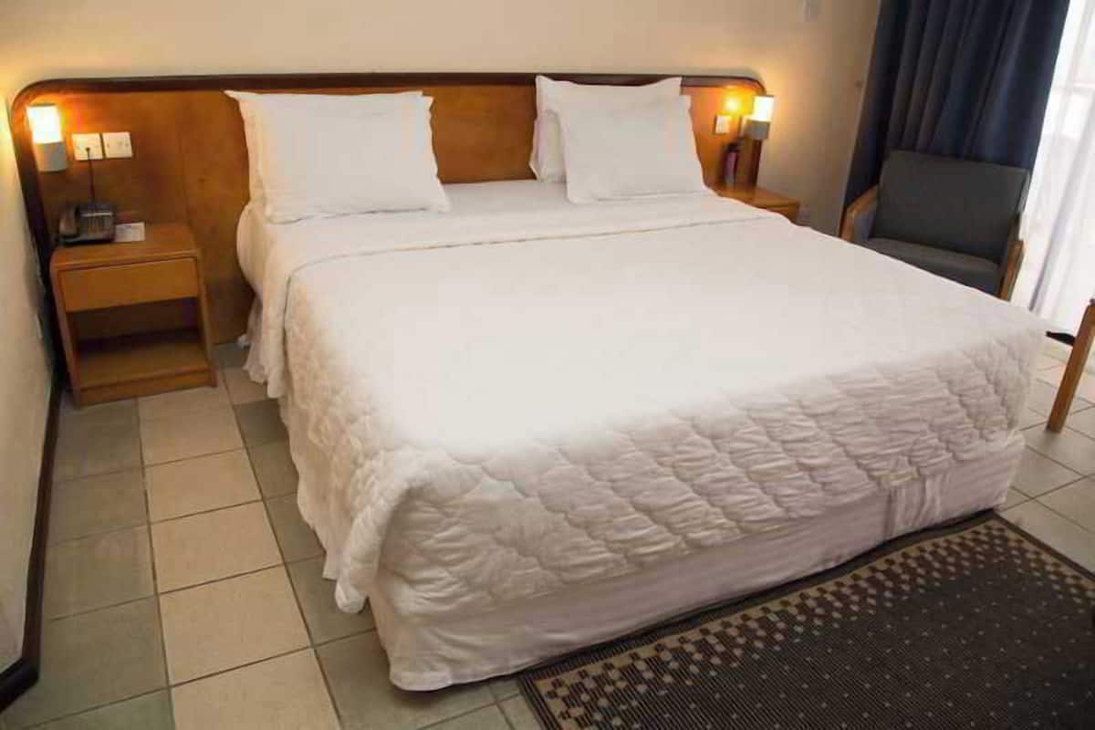 Egyptian cotton sheets, premium bedding, down duvets, minibar