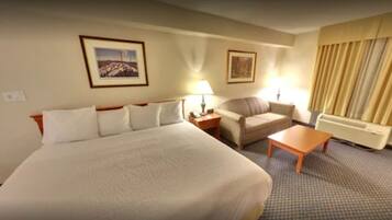 Suite, 1 très grand lit et 1 canapé-lit, non-fumeur (Jacuzzi) | Bureau, rideaux d’obscurcissement, fer et planche à repasser