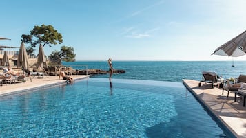 Indoor pool, seasonal outdoor pool, pool umbrellas, pool loungers