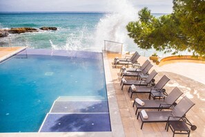 Indoor pool, seasonal outdoor pool, pool umbrellas, pool loungers