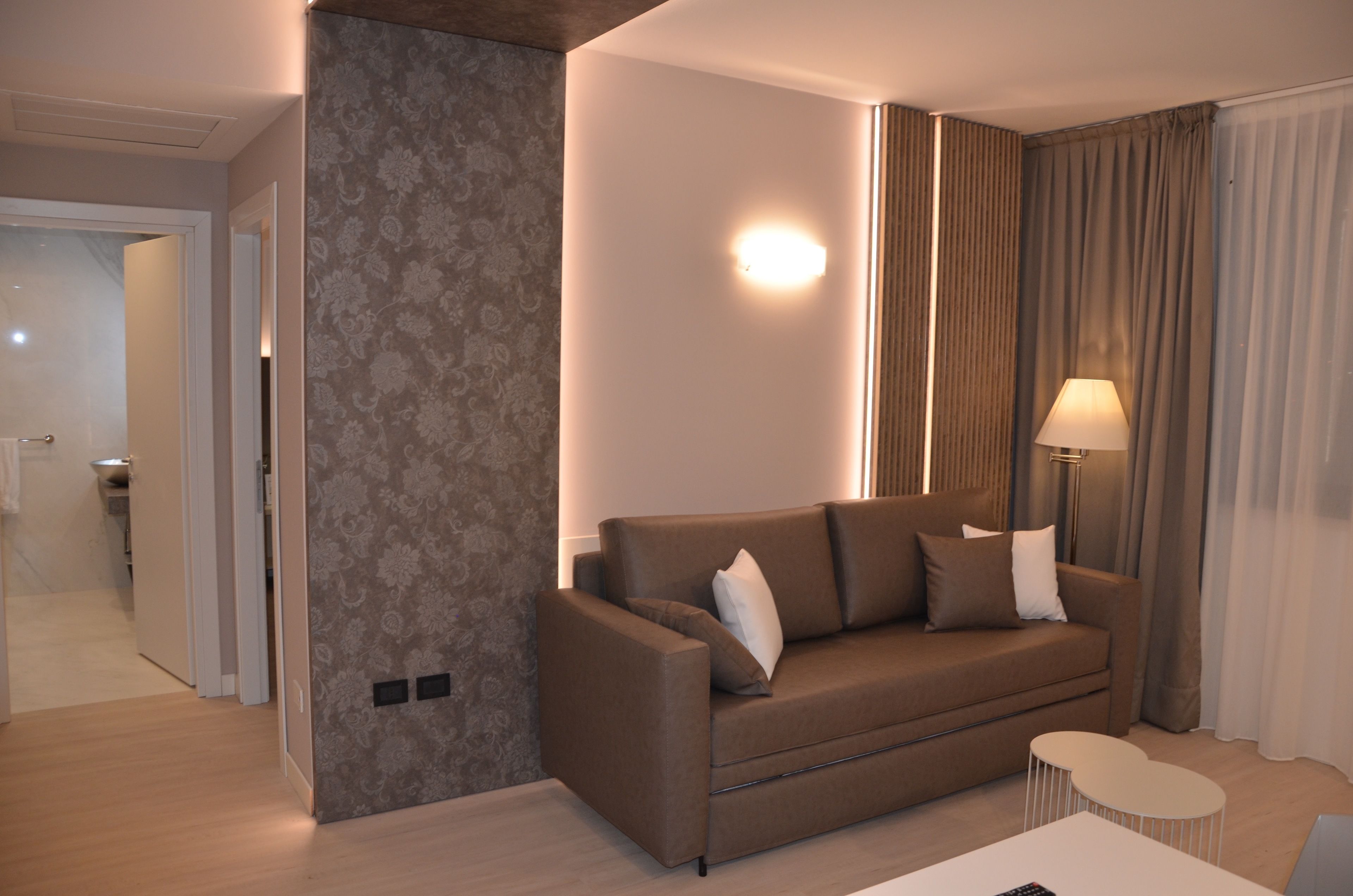 exclusive suite, 1 king bed | living area | 32-inch tv with cable channels