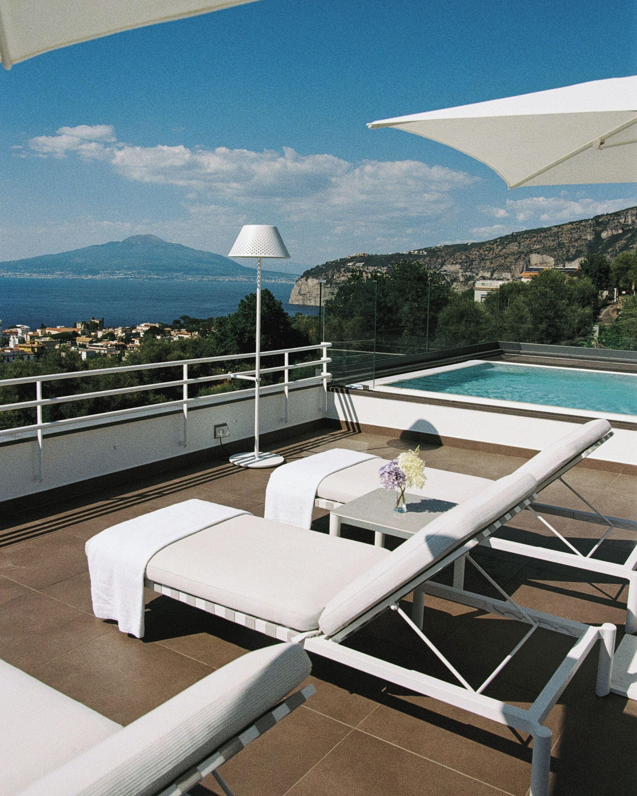 Seasonal outdoor pool, open 10:00 AM to 7:00 PM, pool umbrellas