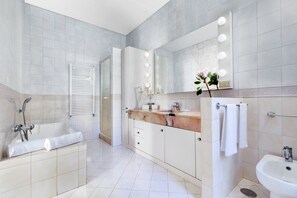 Deluxe Room | Bathroom | Designer toiletries, hair dryer, slippers, bidet