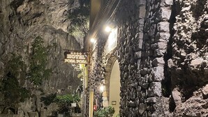 A hotel entrance with a stone facade, a sign reading "HOTEL POSA POSA," and a road curving to the left. - Hotel Posa Posa (Positano)