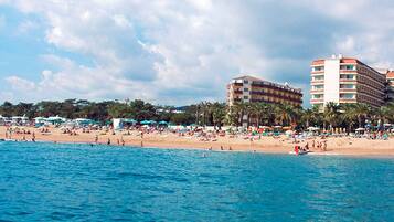 On the beach, sun-loungers