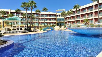 Indoor pool, outdoor pool, pool umbrellas, pool loungers