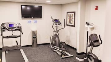 A fitness center with treadmills, an elliptical, and a stationary bike.