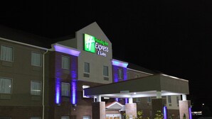 A Holiday Inn Express & Suites building with a prominent sign, multiple windows, and a flat roof. - Holiday Inn Express & Suites Sweetwater by IHG (Sweetwater)