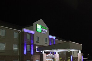 A Holiday Inn Express & Suites building with a prominent sign, multiple windows, and a flat roof. - Holiday Inn Express & Suites Sweetwater by IHG (Sweetwater)