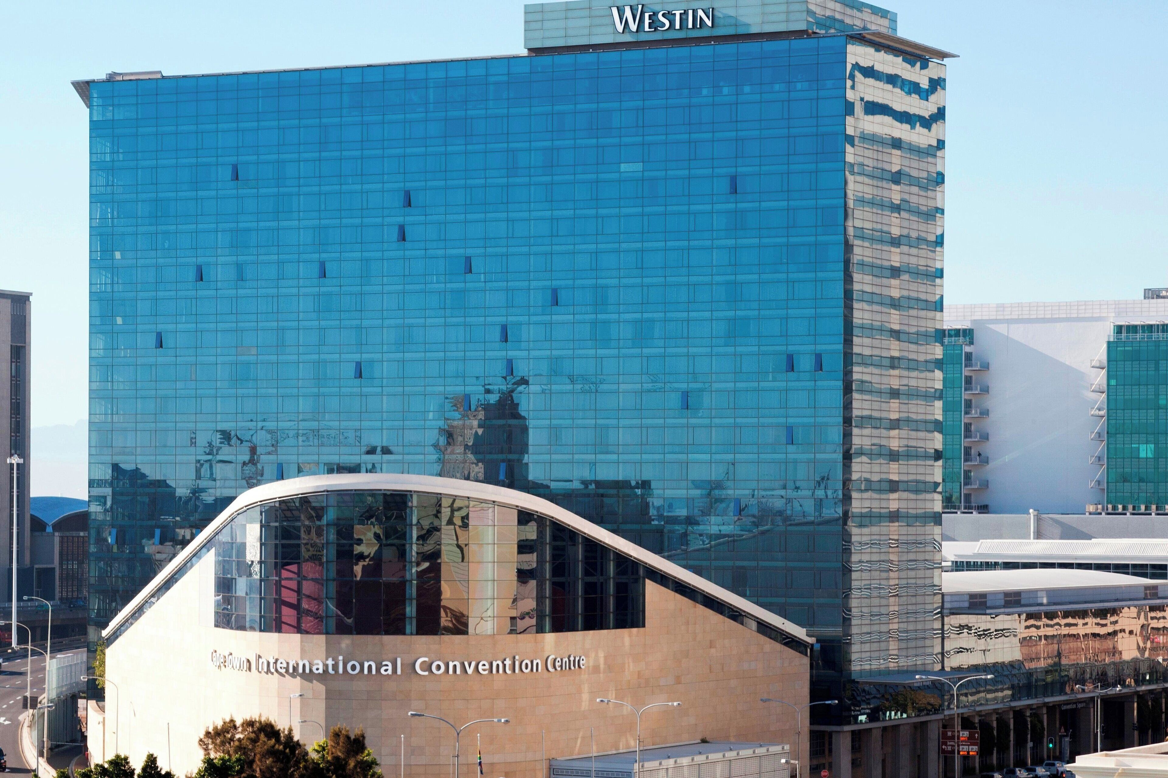 A modern building with a glass facade and the name "Westin" at the top.