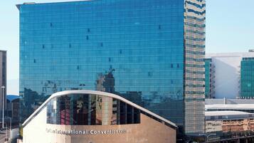 A modern building with a glass facade and the name "Westin" at the top.