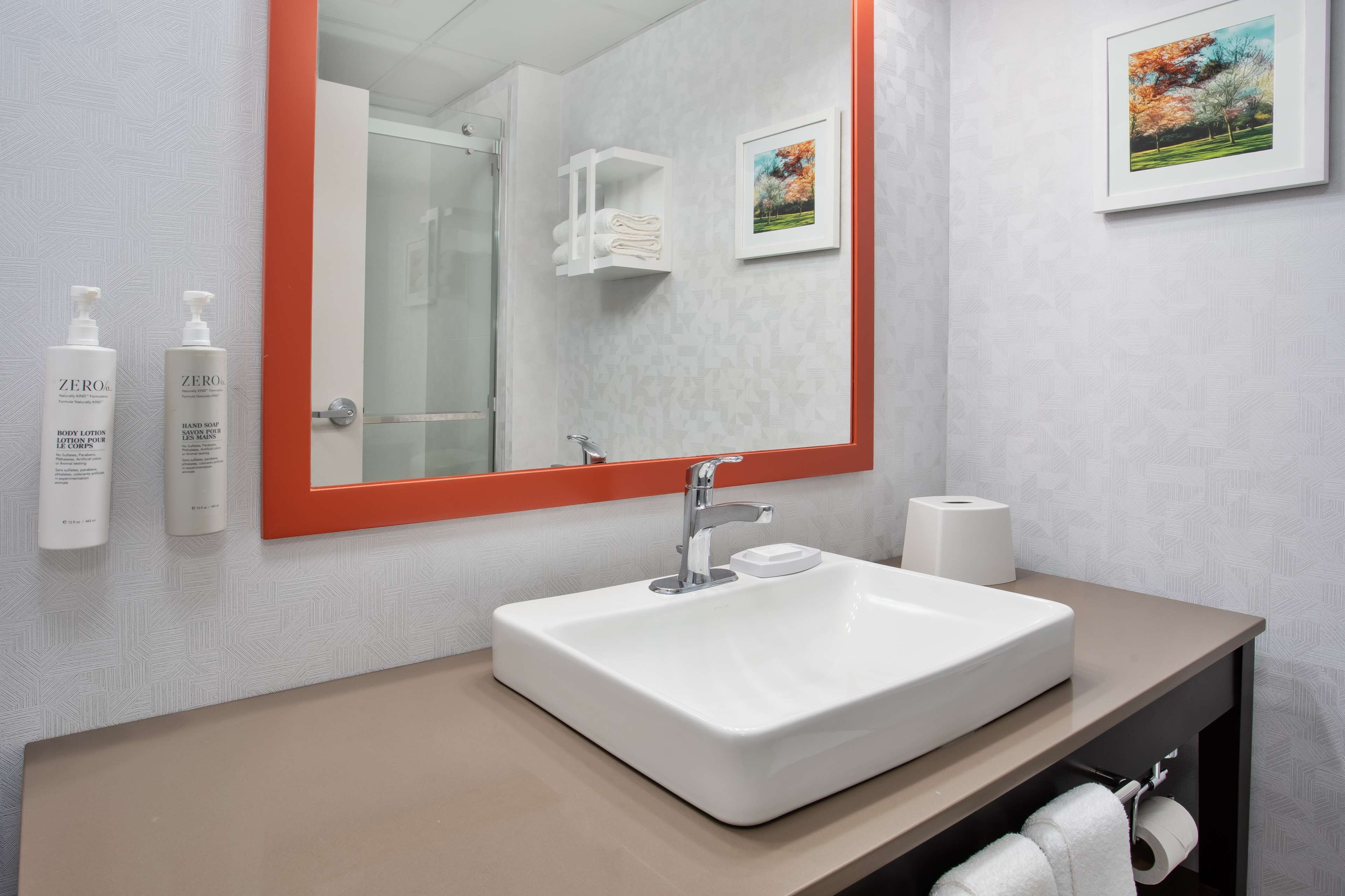 suite, 1 king bed, refrigerator & microwave (wet bar) | bathroom | combined shower/bathtub, free toiletries, hair dryer, towels