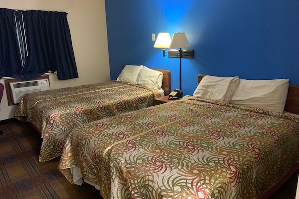 Economy Quadruple Room, 2 Queen Beds, Non Smoking | WiFi (free), individually decorated, individually furnished, bed sheets