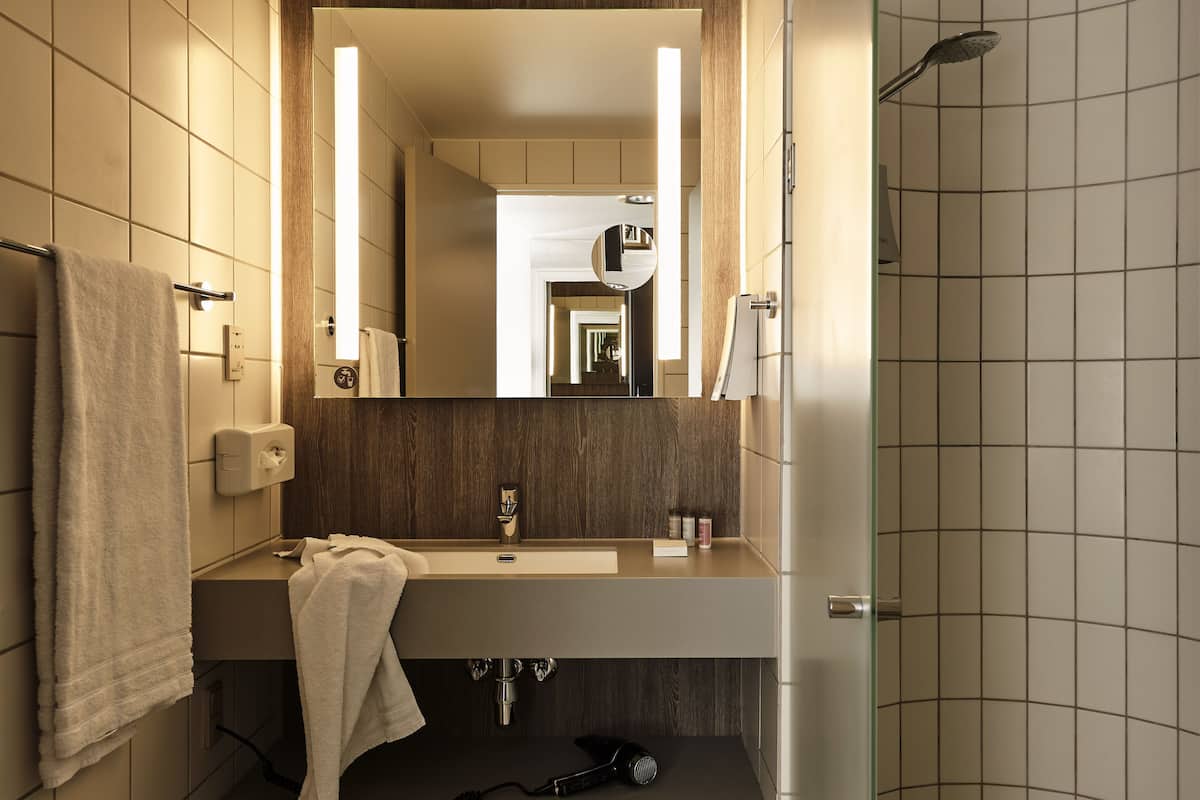 eco-friendly toiletries, hair dryer, towels, soap