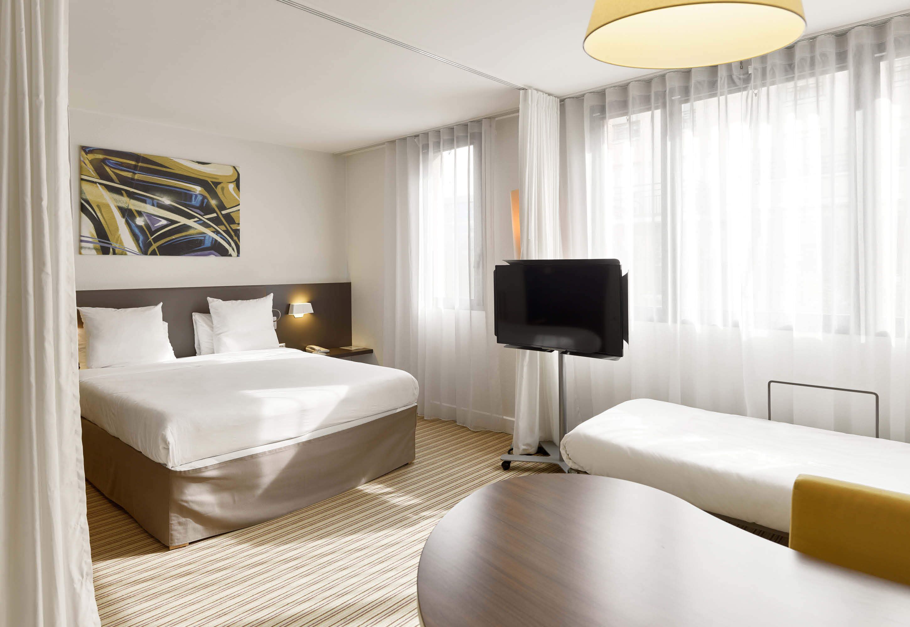 triple room, multiple beds, non smoking | minibar, in-room safe, desk, laptop workspace