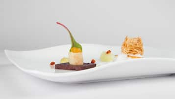 A white plate with various food items.