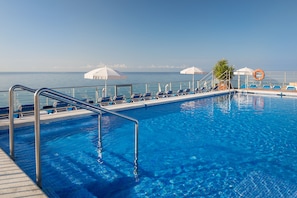 Outdoor pool, pool umbrellas, pool loungers