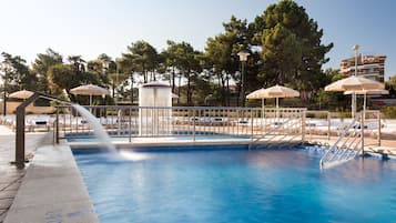 Indoor pool, pool umbrellas, pool loungers