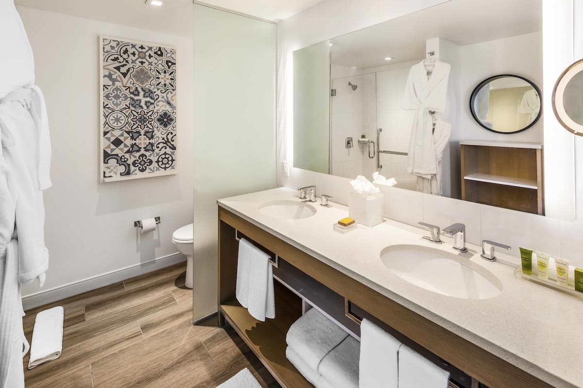 Rainfall showerhead, designer toiletries, hair dryer, towels